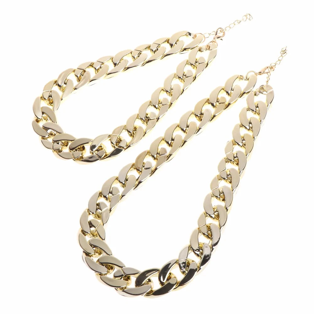 Two Gold Rock Star Pet Chain Necklaces on a white background.