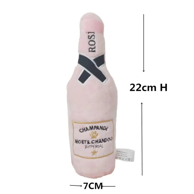 pink champagne dog play toy, white background, showing dimensions.