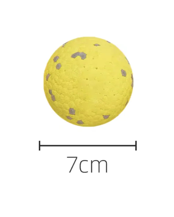 yellow ball chew toy on white background showing dimensions of 7 cms diameter
