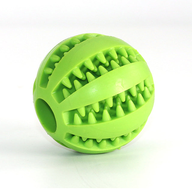 Green chewable treat dispenser ball on white background. 