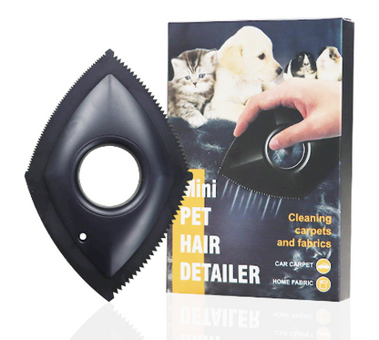 black Mini pet hair detailer, next to vertical product packaging on white background.