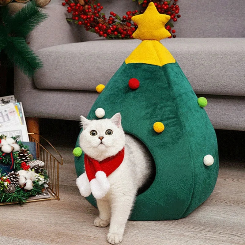 A white cat walking out of the Christmas Cat Bed in a home setting
