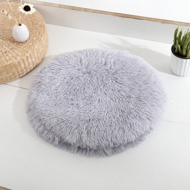 light grey colored pet bed in home setting. 