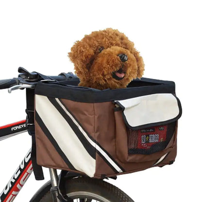 small brown dog in a brown pet bicycle basket carrier attached to a bicycle, white background.