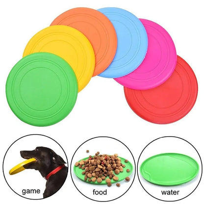 Six color variants of the Soft Non-Slip Flying Disc on a white background. Three smaller images in the foreground show the disc in a dog's mouth and being used as a food and water bowl. white background. 