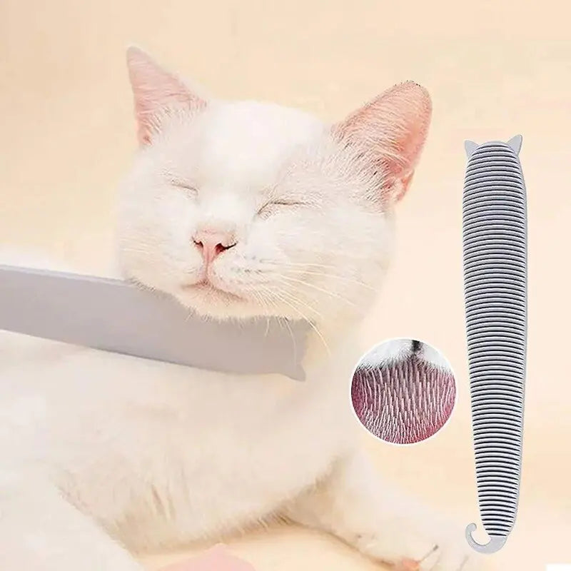 main image a white cat, cream background, having it's neck rubbed with  a grey pet hair remover brush, a small insert image - close up of a cat's tongue, showing the design feature. 