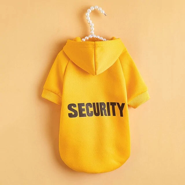 yellow SECURITY pet hoodie on a pale yellow background