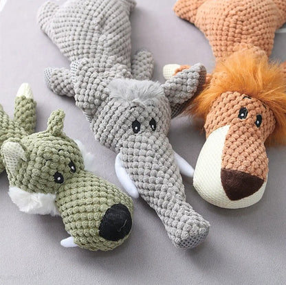 three designs of Munchie Chew Toys on a pale grey background, wolf, elephant and lion. 