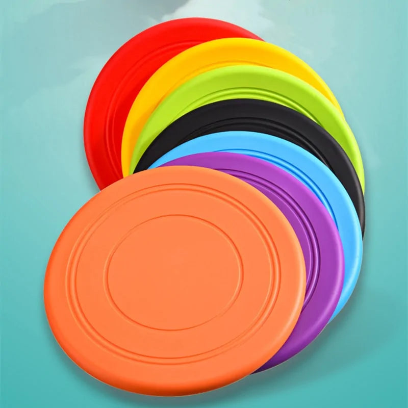 Seven color varieties of the Soft Non-Slip Flying Disc, blue background