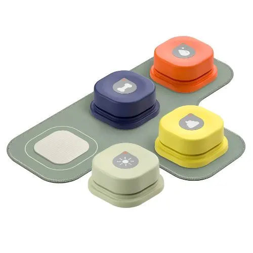 four different colored Speak & Play Dog Communicator buttons on a white background