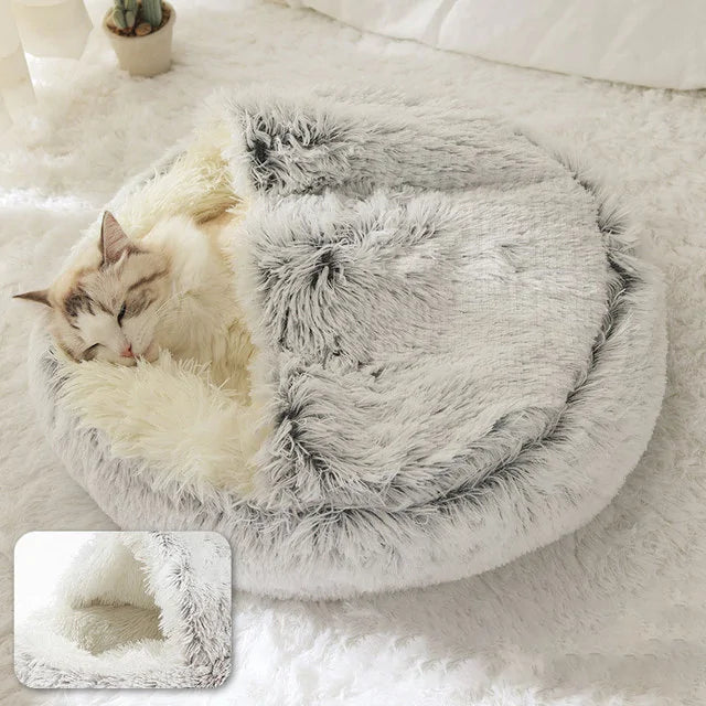 kitten sleeps in a grey snuggle beds in a home setting, insert image shows close up shot of the soft lining.