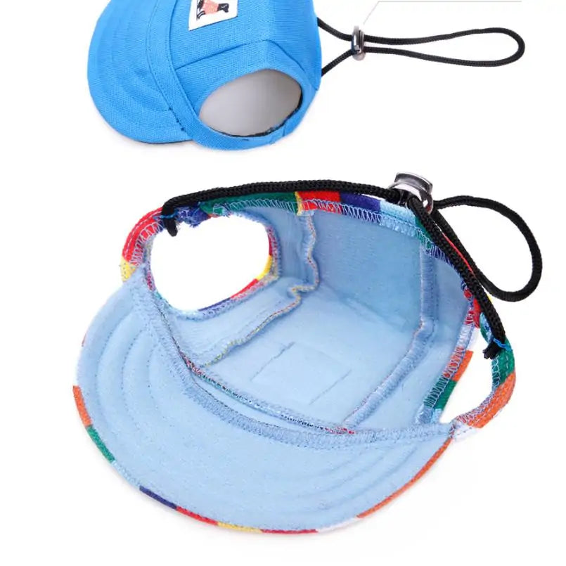 two pet baseball caps on a white background, showing both top and underside of the cap, straps and stitching. 