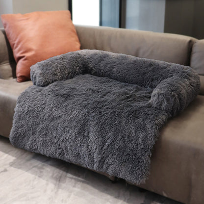 Dark grey sofa bed on a brown couch in a home setting