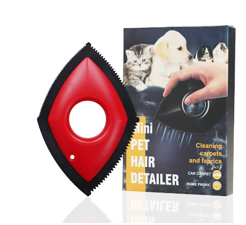 red Mini pet hair detailer, next to vertical product packaging on white background.