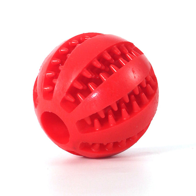 Red chewable treat dispenser ball on white background. 