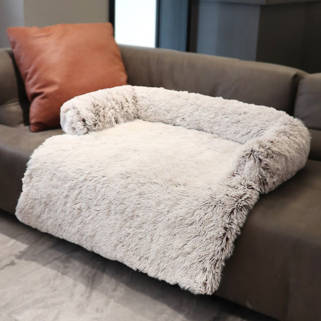 Coffee color  sofa bed on a brown couch in a home setting
