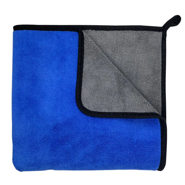 Blue towel with reverse side showing color contrast. white background. 