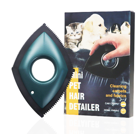 green Mini pet hair detailer, next to vertical product packaging on white background.