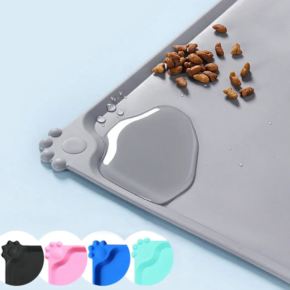 Grey Ultimate Silicone Pet Bowl Mat with a pool of water, showing water resistance. smaller inset images show color variants. 