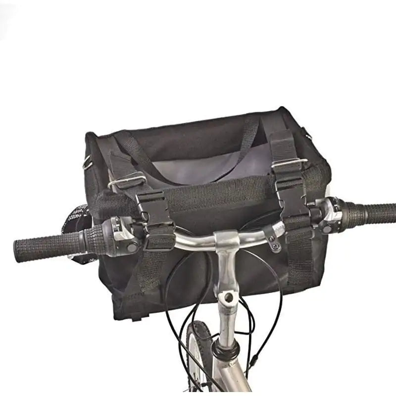 close up shot of a pet basket carrier attached to a bicycle, white background. 