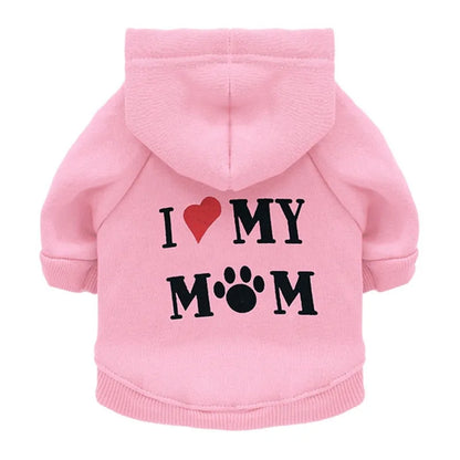 Pink 'I love my Mom' Stylish Pet Hoodie on a white background. The word Love is depicted by a red heart and the 'o' in the word mom is depicted with a pawprint. 