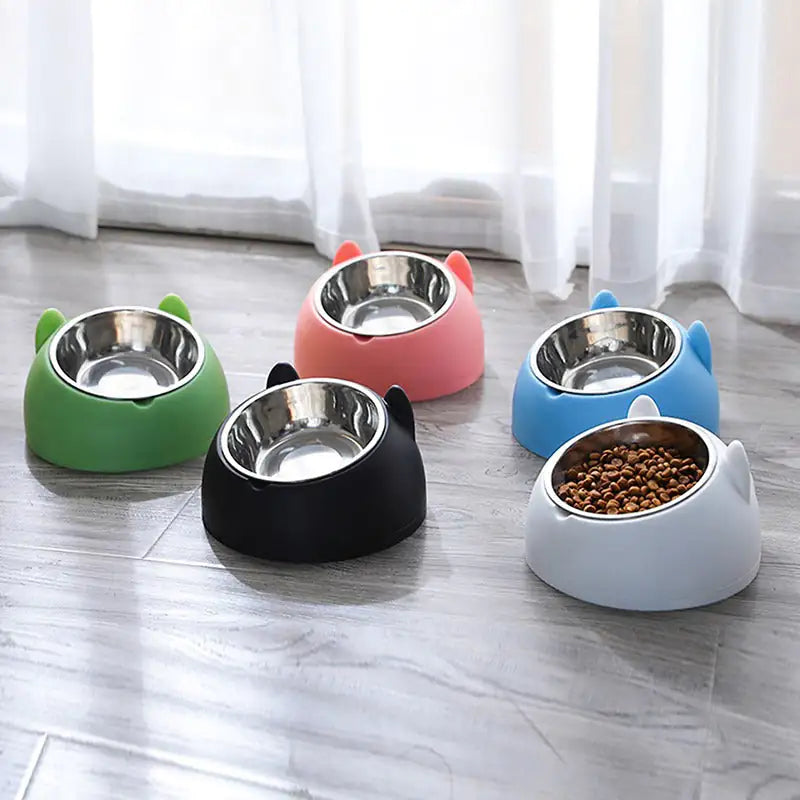 five colour variants of the purrfect cat bowl, positioned on a vinyl floor in a home setting. 