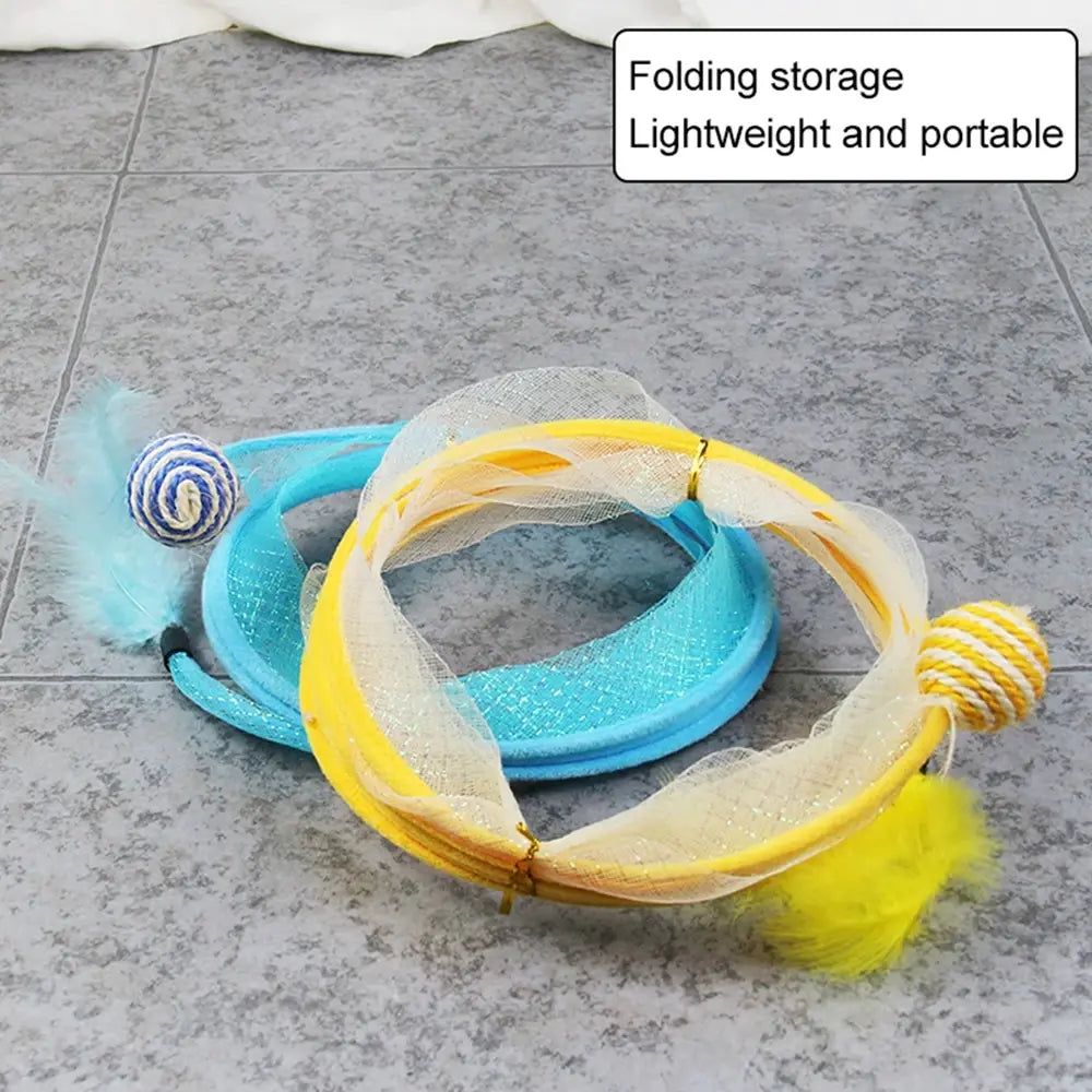 a blue and yellow Whisker Wonderland Cat Tunnel are folded on a grey surface 