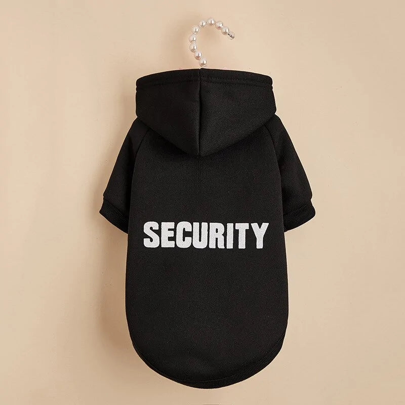 black SECURITY hoodie on a cream background 
