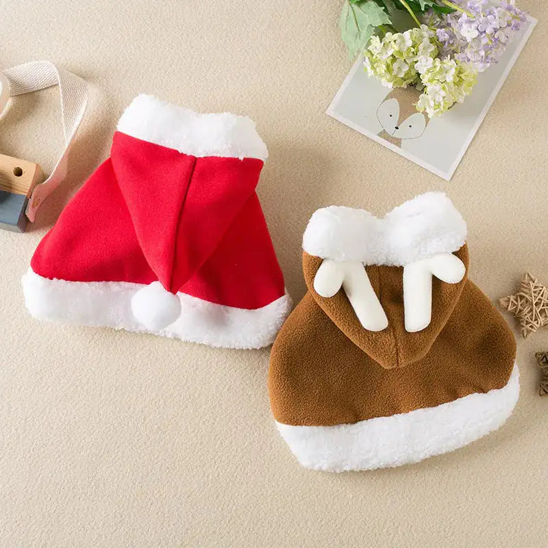 Brown and Red Festive Paws Holiday Capes in a home setting, displayed on beige carpet. 