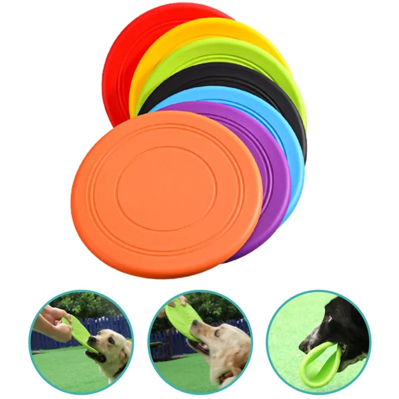 Seven color variants of the Soft Non-Slip Flying Disc on a white background. Three smaller images in the foreground show dogs playing with the discs, demonstrating durability. 