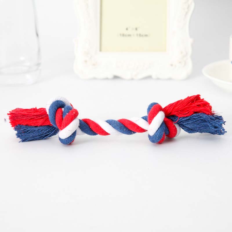 Red, white and blue rope toy on white background