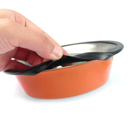 close up shot of rubber non-slip ring on bottom of an orange stainless steel pet bowl. white background