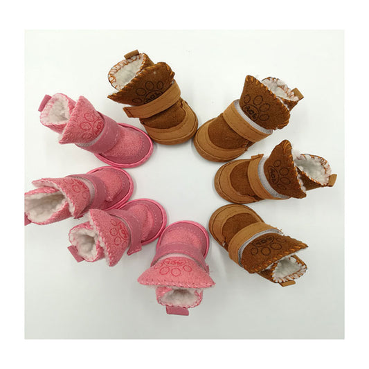 two sets of snow boots, one pink, one brown on a white background. 