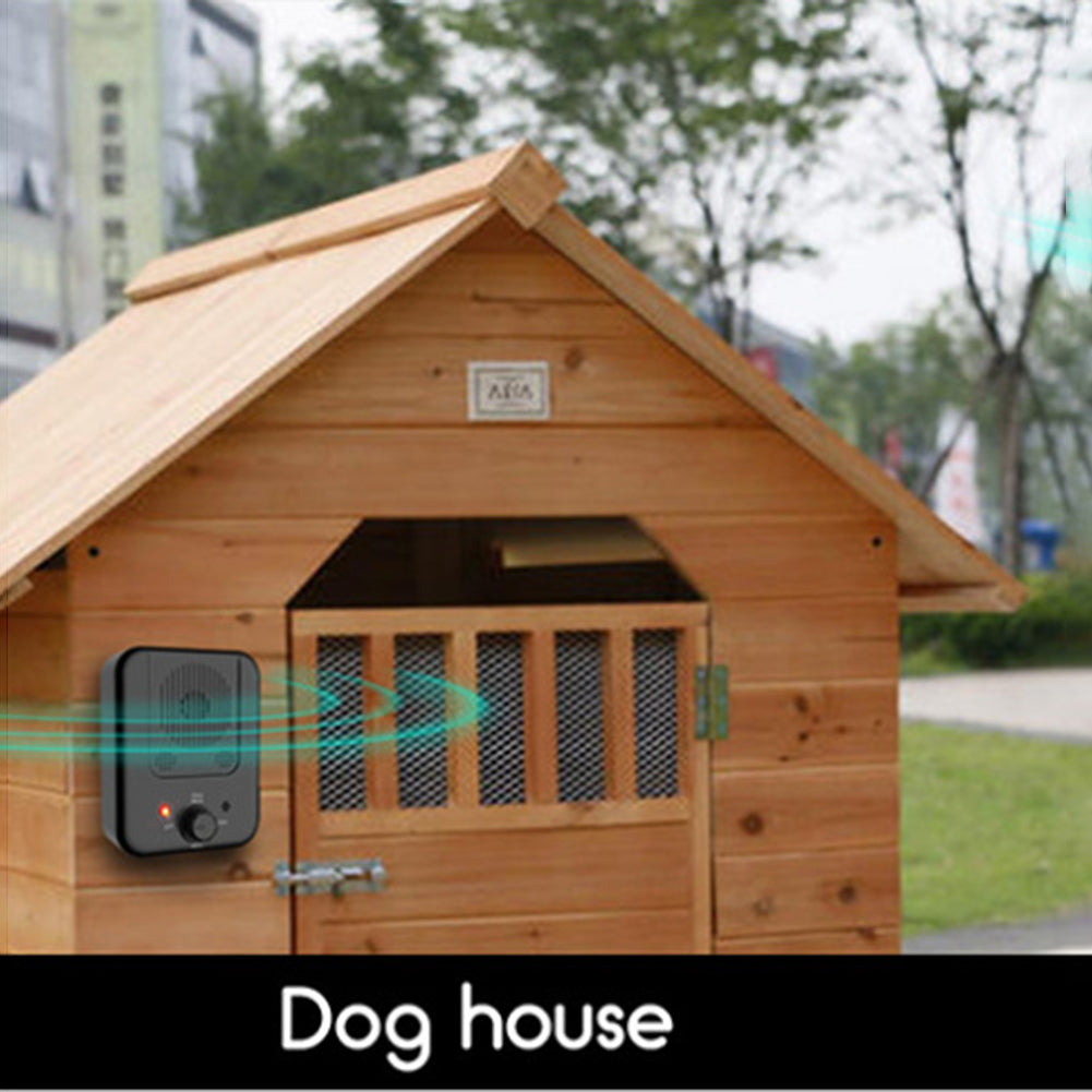 Image of a wooden dog house outdoors with a black device attached to it. Rings around the device depict ultrasonic rays.