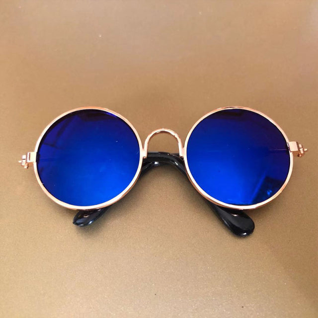 dark blue sunglasses on beige background