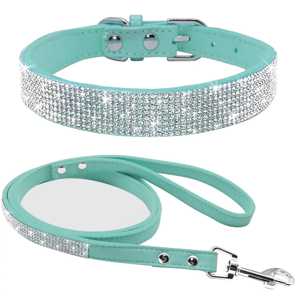 Blue colored rhinestone pet collar and leash on white background. 