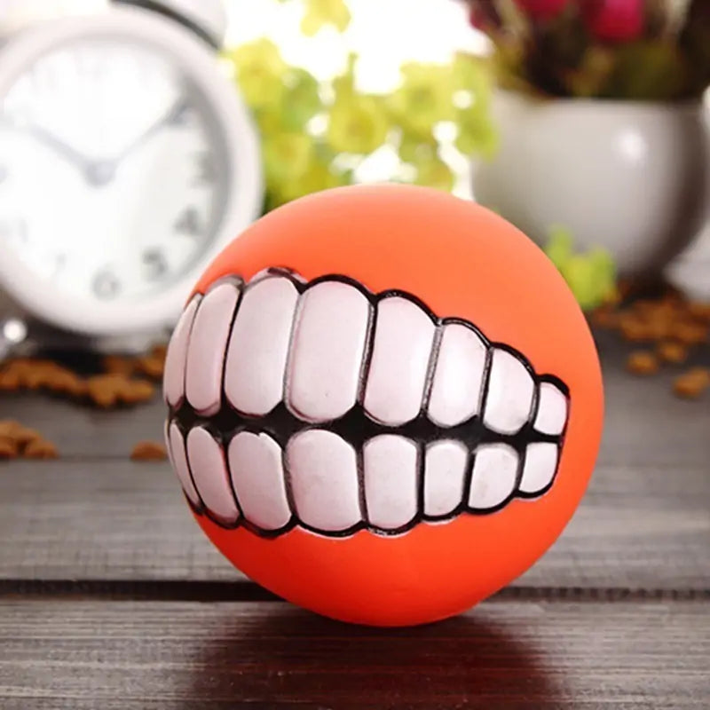 orange smile ball in a lifestyle shot on a wooden surface. 