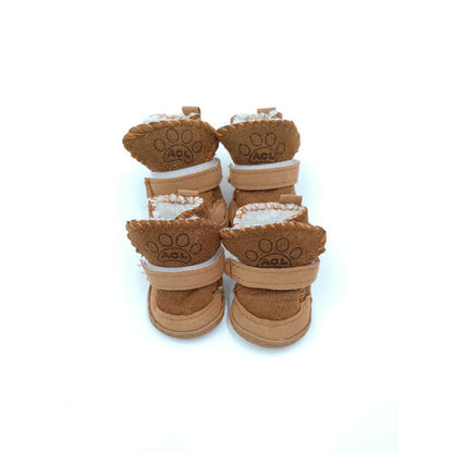 a set of brown snow boots on white background