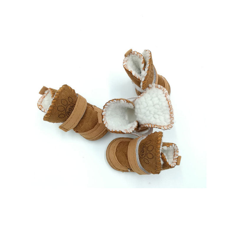 A set of brown snow boots in different positions on a white background. 