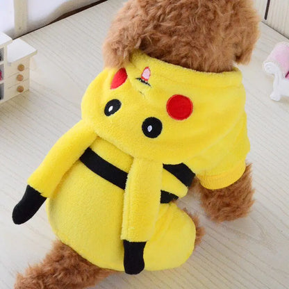 side view of a small brown dog wearing a yellow Pikachu costume in a home setting. 