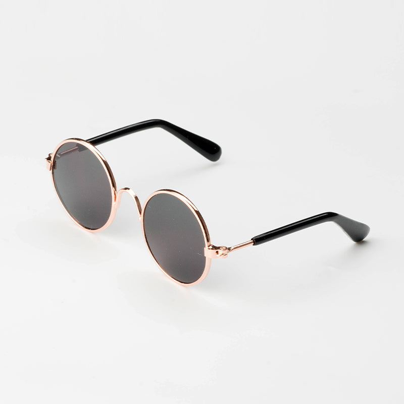 side view of black sunglasses on white background